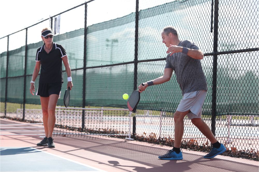 What is Stacking in Pickleball? 2 A mixed doubles team plays pickleball